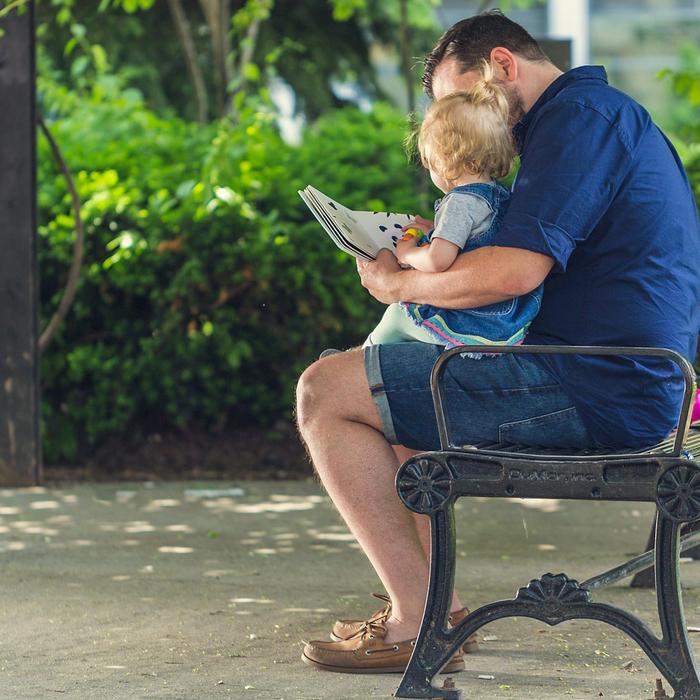 man reading to small child